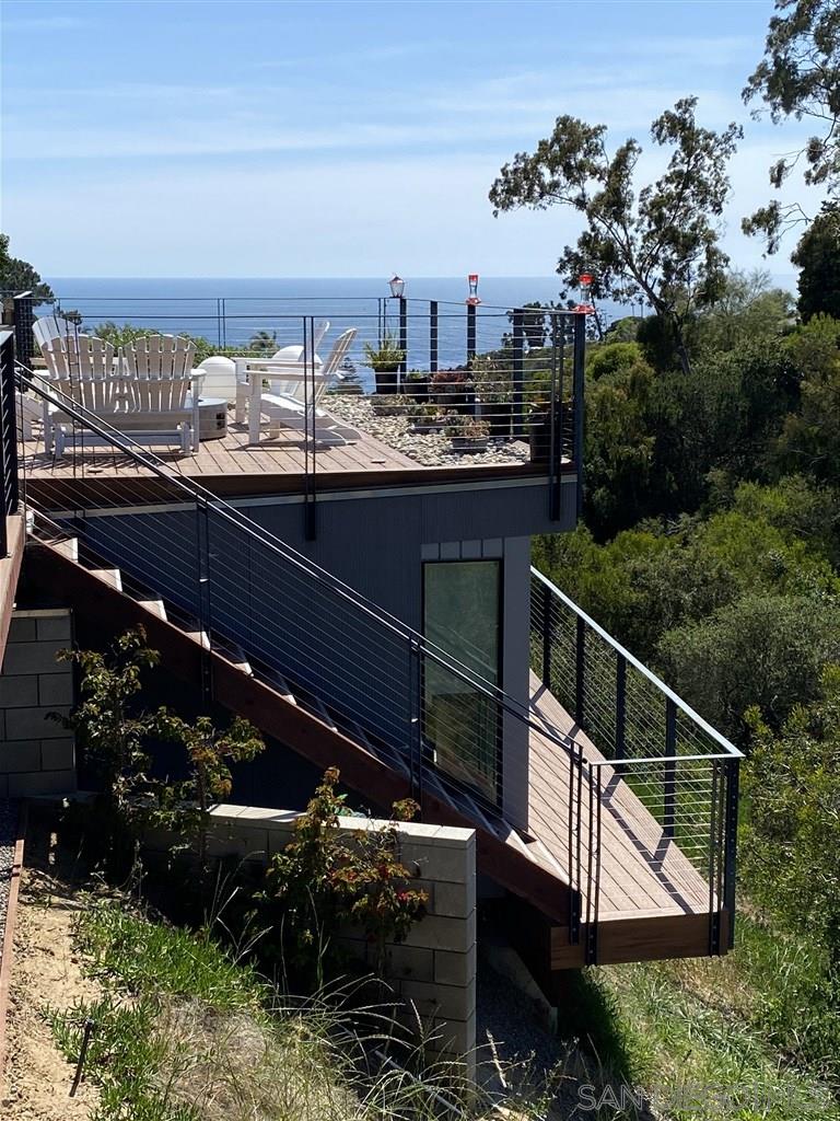 1402 Rodeo Drive La Jolla, CA 92037 - Photo 16 of 42 a view of a terrace with a bench