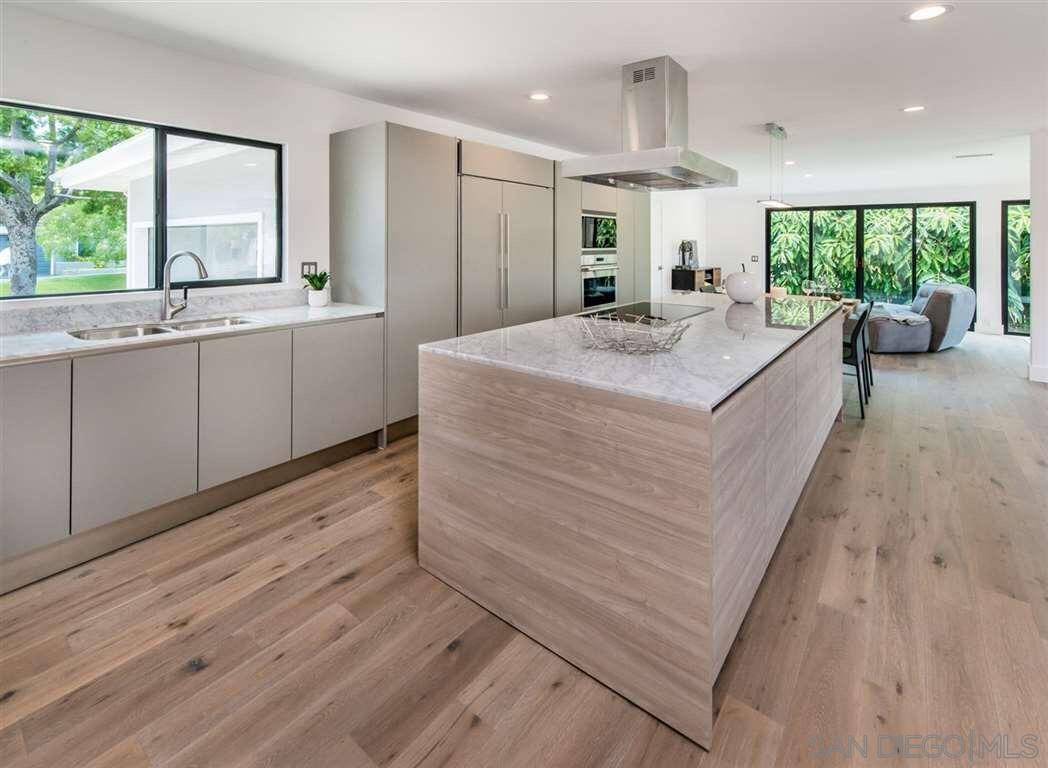 1402 Rodeo Drive La Jolla, CA 92037 - Photo 2 of 42 a large white kitchen with a large window