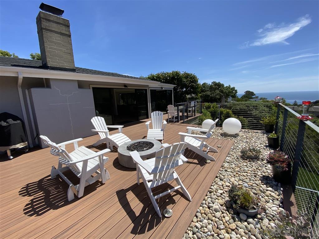 1402 Rodeo Drive La Jolla, CA 92037 - Photo 22 of 42 a terrace of a house with outdoor seating