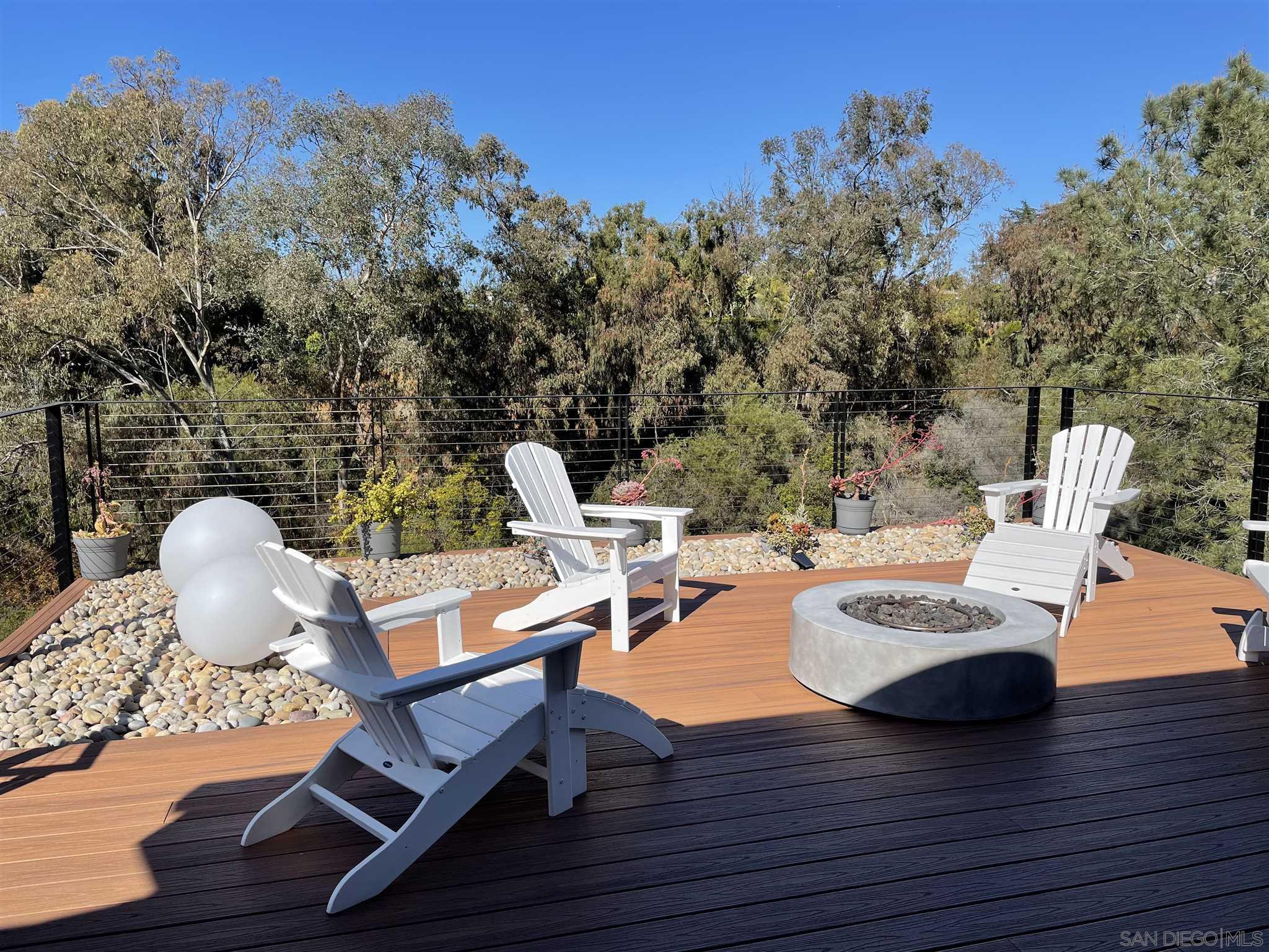 1402 Rodeo Drive La Jolla, CA 92037 - Photo 28 of 42 a view of a deck with furniture and a backyard