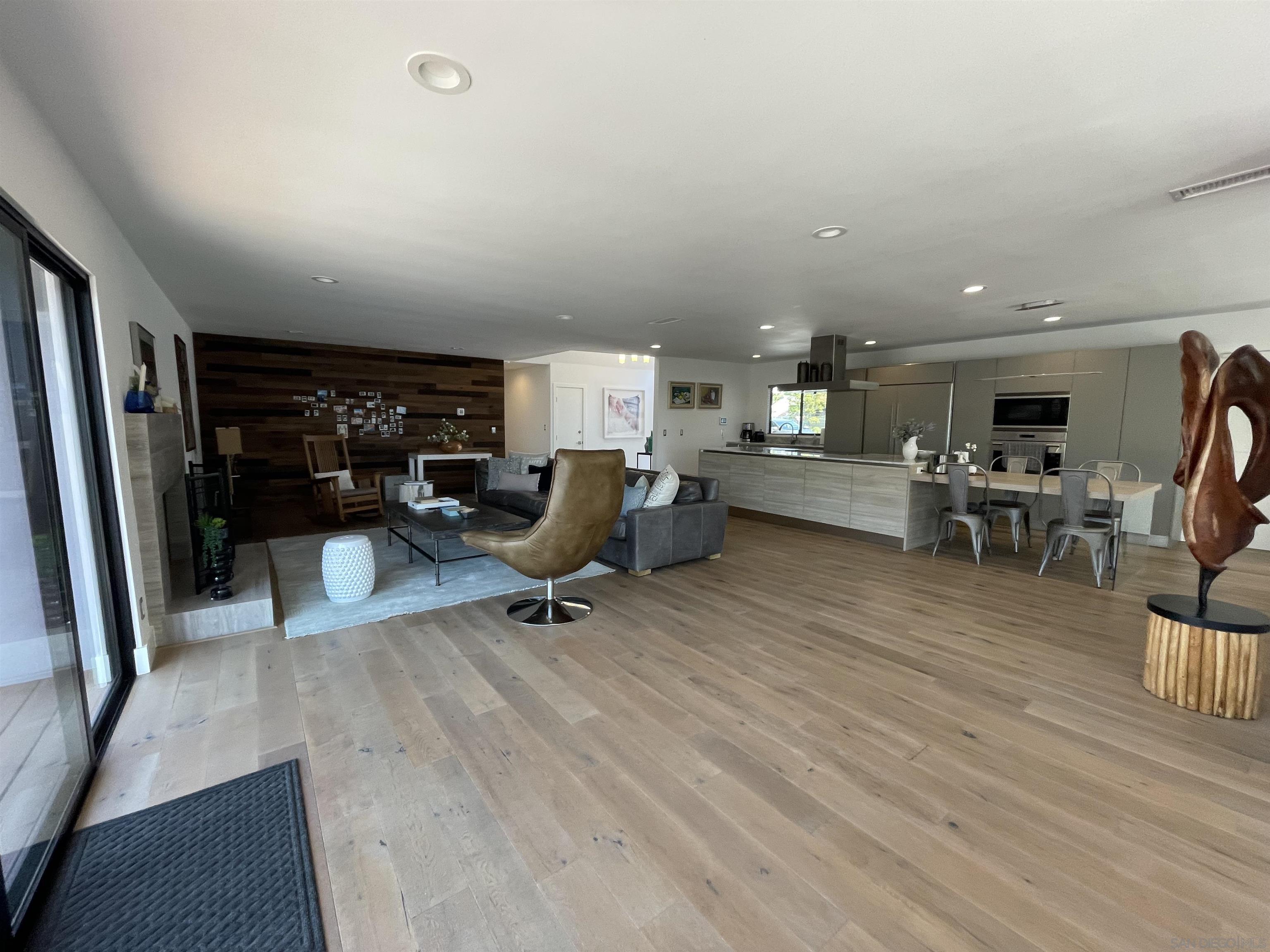 1402 Rodeo Drive La Jolla, CA 92037 - Photo 37 of 42 a view of a workspace with furniture and a kitchen