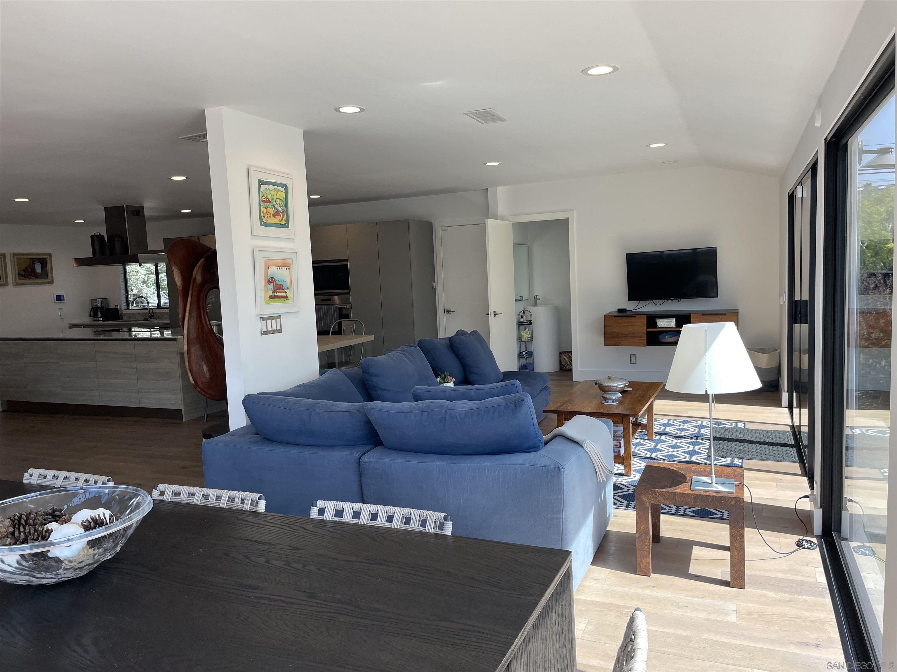 1402 Rodeo Drive La Jolla, CA 92037 - Photo 39 of 42 a living room with furniture and a flat screen tv