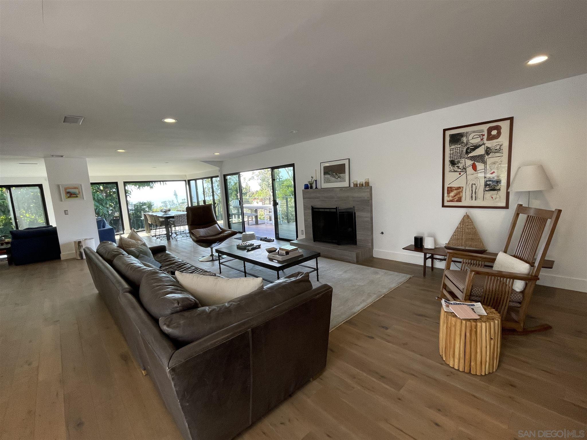 1402 Rodeo Drive La Jolla, CA 92037 - Photo 4 of 42 a living room with furniture and a fireplace