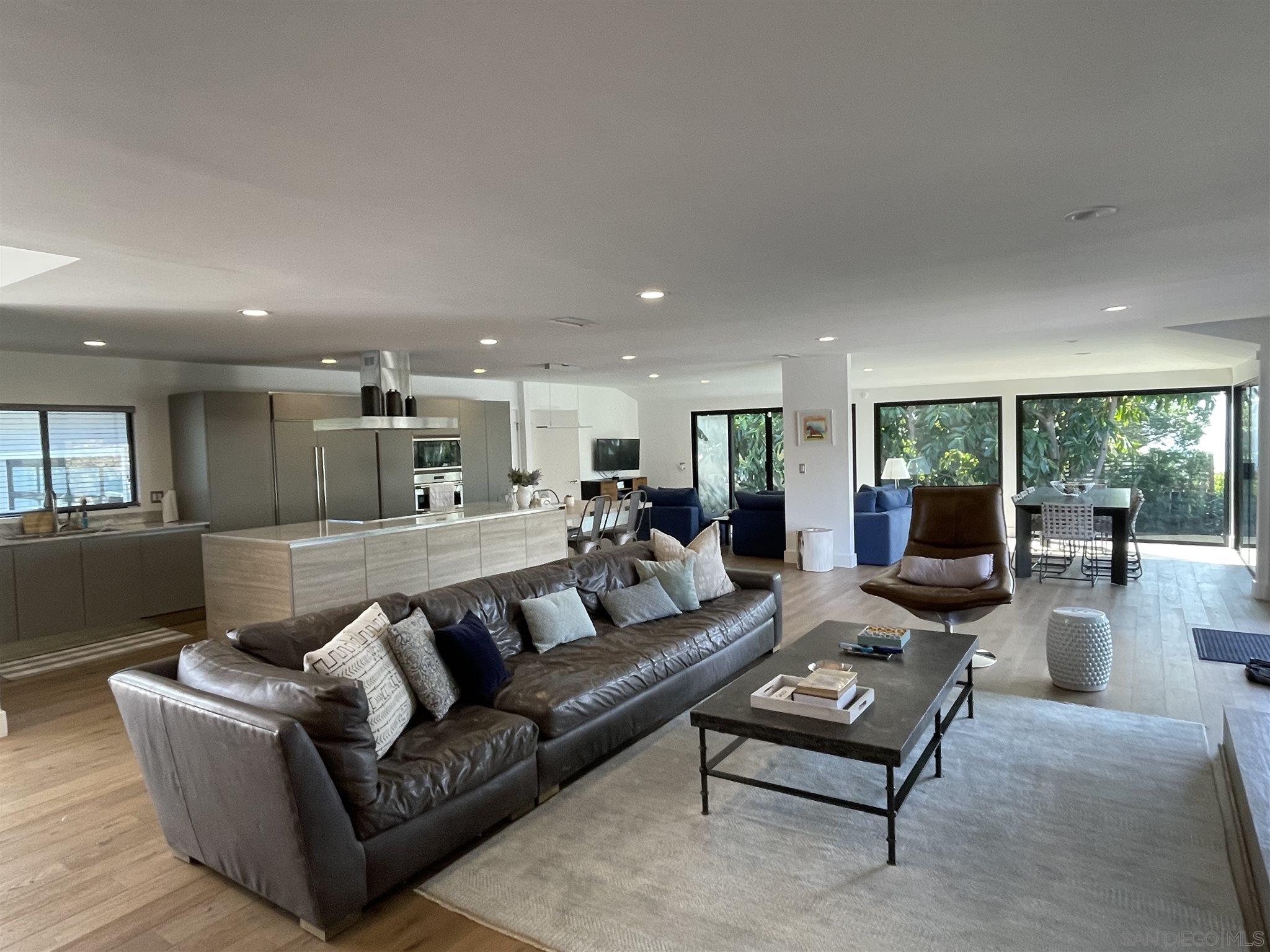 1402 Rodeo Drive La Jolla, CA 92037 - Photo 5 of 42 a living room with furniture and wooden floor