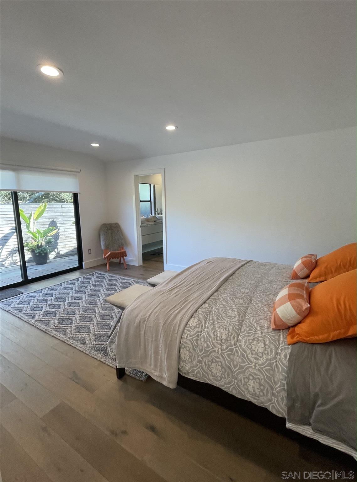 1402 Rodeo Drive La Jolla, CA 92037 - Photo 6 of 42 a bedroom with a bed and window