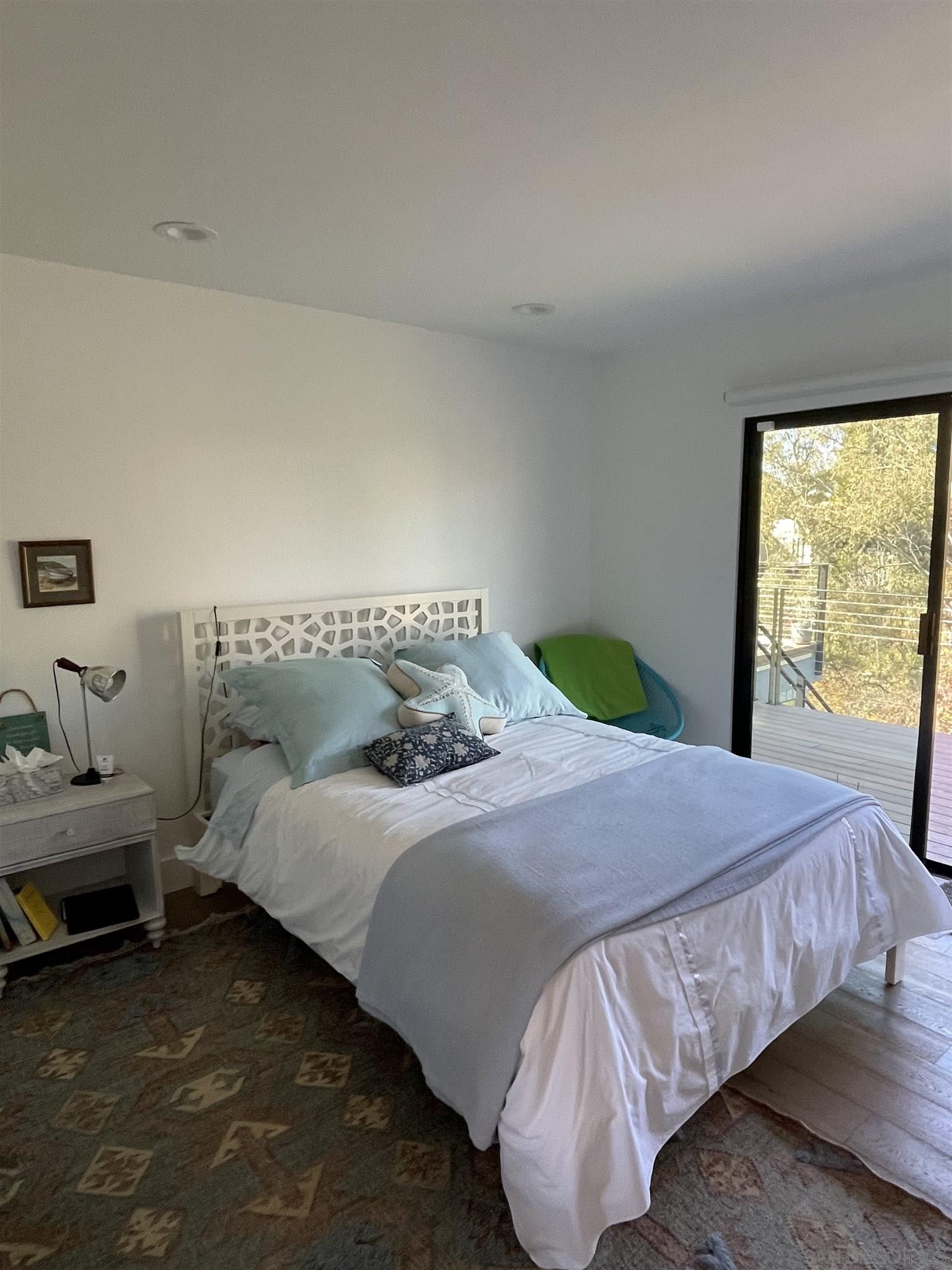 1402 Rodeo Drive La Jolla, CA 92037 - Photo 10 of 42 a bedroom with a bed and a window
