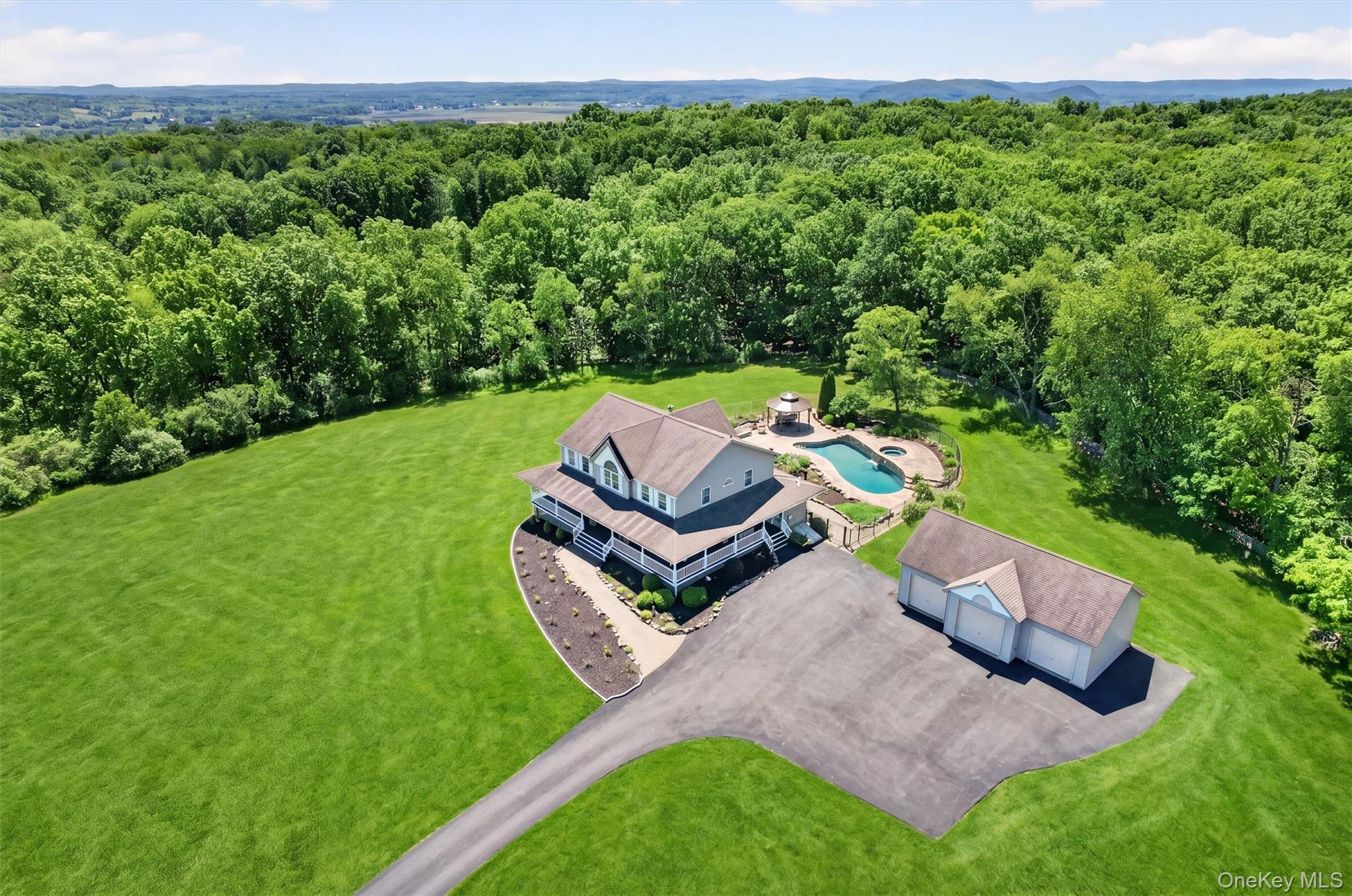 954 Ridgebury Road New Hampton, NY 10958 - Photo 3 of 45 A sweeping aerial view captures the lifestyle this property offers, with room to breathe, open lawns, a 3-car detached garage, and a backyard designed for relaxing and entertaining.