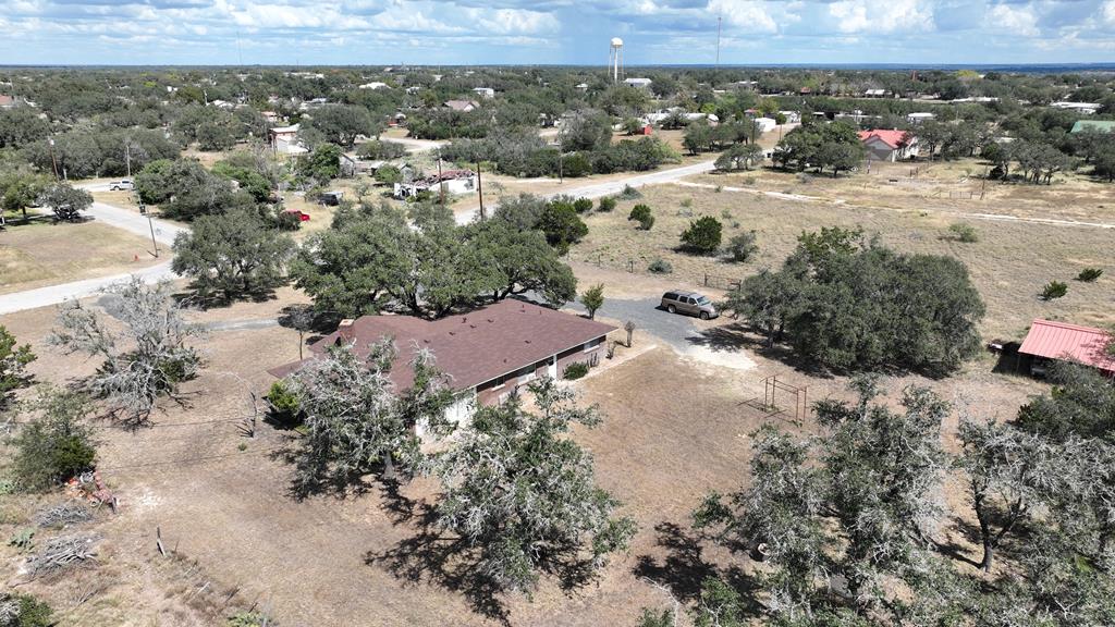 601 Other Rocksprings, TX 78880 - Photo 5 of 9 an aerial view of a house with a yard