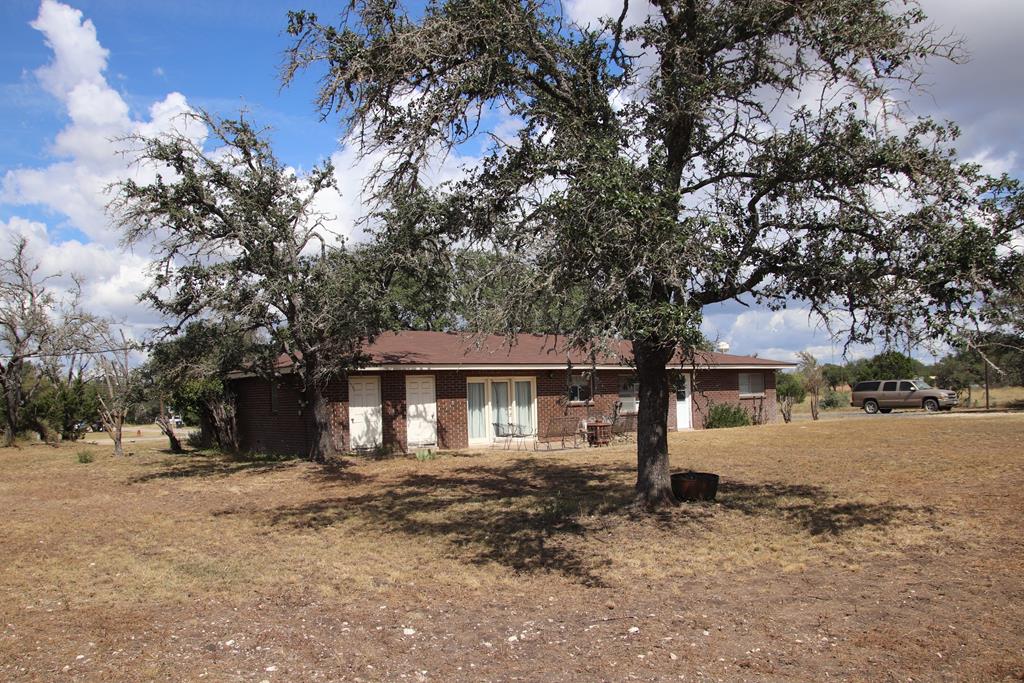 601 Other Rocksprings, TX 78880 - Photo 8 of 9 a front view of a house with a yard