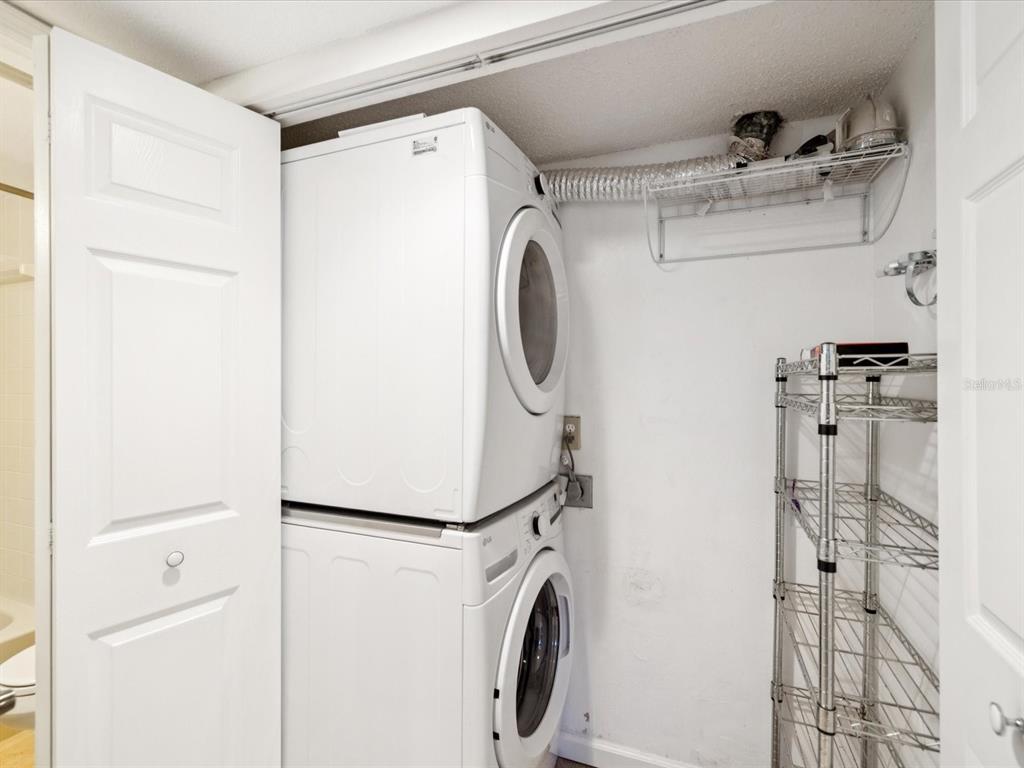 12900 Vonn Road, Unit E203 Largo, FL 33774 - Photo 14 of 26 a utility room with dryer and washer