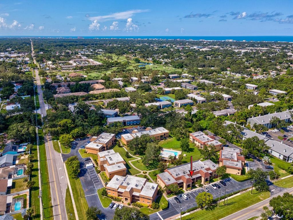 12900 Vonn Road, Unit E203 Largo, FL 33774 - Photo 18 of 26 an aerial view of residential houses with outdoor space