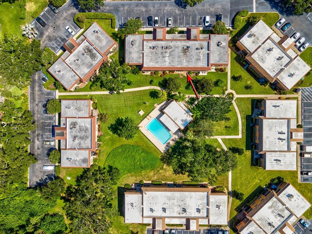 12900 Vonn Road, Unit E203 Largo, FL 33774 - Photo 21 of 26 an aerial view of residential houses with outdoor space and parking