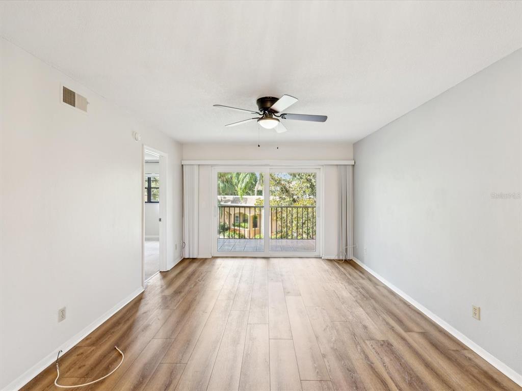 12900 Vonn Road, Unit E203 Largo, FL 33774 - Photo 3 of 26 a view of an empty room with a window