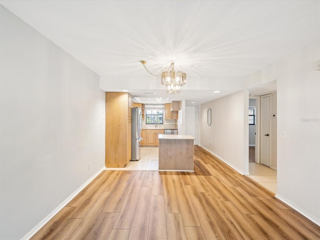 12900 Vonn Road, Unit E203 Largo, FL 33774 - Photo 7 of 26 a view of a room with wooden floor and a window