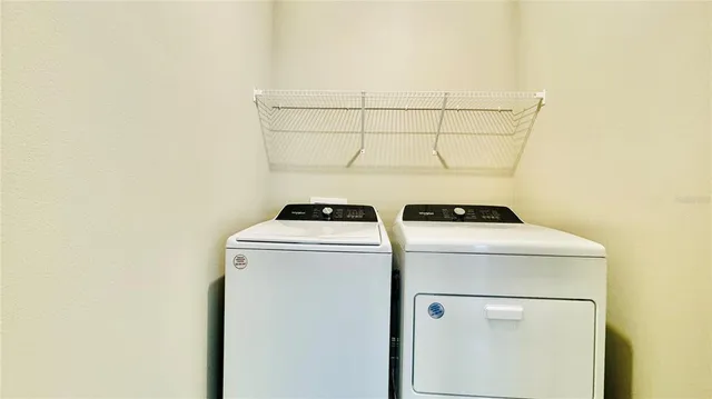 a bathroom with a sink toilet vanity and shower