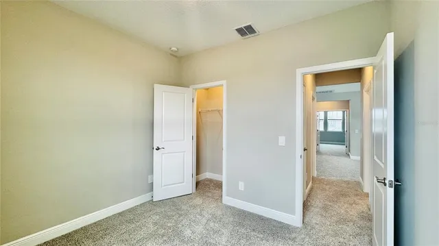 an empty room with closet area