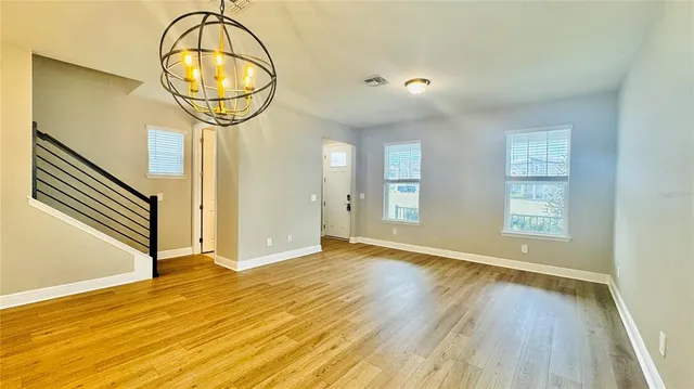 a bathroom with a sink mirror and toilet