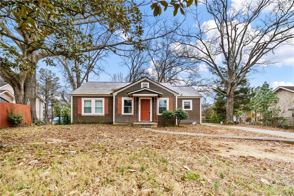 8 Lucille Avenue Rome, GA 30165 - Photo 1 of 1 a front view of a house with a yard covered in snow