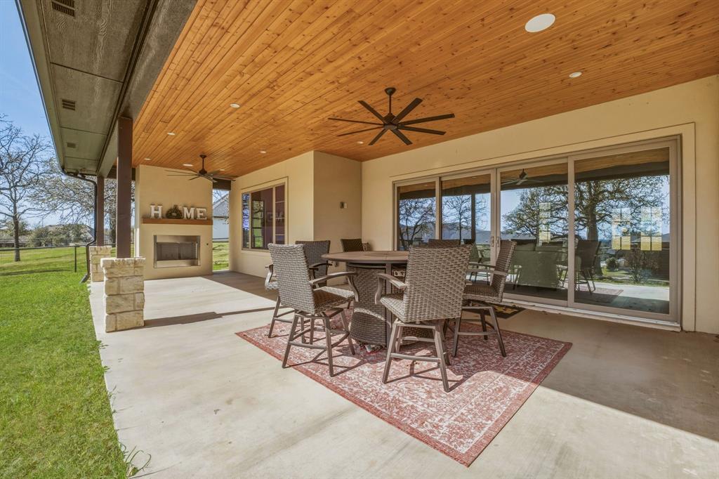 4009 Pinnacle Ridge Way Granbury, TX 76049 - Photo 29 of 35 Covered Patio with Wood Burning Fireplace