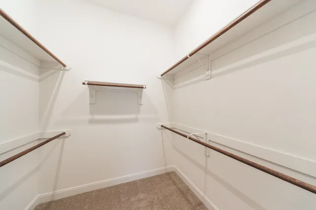 a view of an empty walk in closet