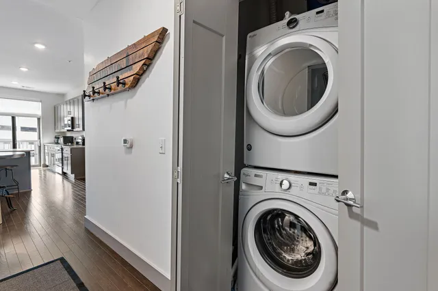 a view of a hallway with washer and dryer
