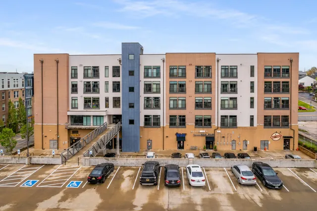 a front view of a building with glass windows and door