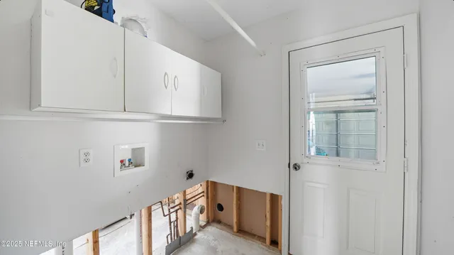 a view of an entryway with wooden floor