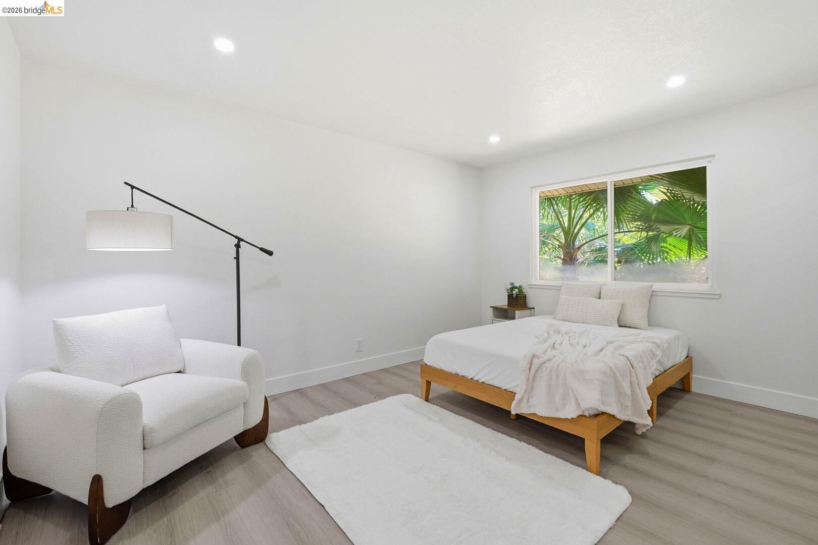 1590 Sunset Road Brentwood, CA 94513 - Photo 21 of 45 Recessed ceiling lighting illuminates a room featuring light-toned wood-finish flooring and white walls