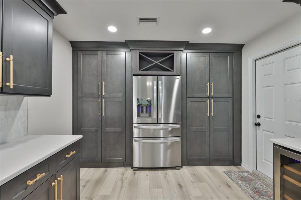 1578 Indian Bay Road Spring Hill, FL 34607 - Photo 19 of 51 a kitchen with stainless steel appliances granite countertop a refrigerator and a sink