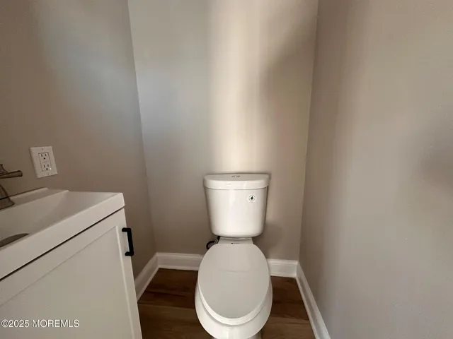 a bathroom with a toilet and a sink