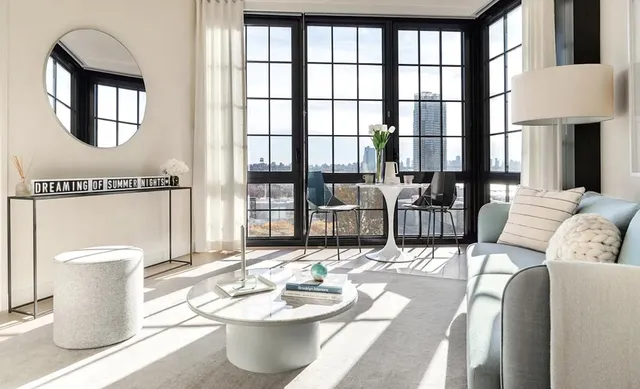 a living room with furniture and a window