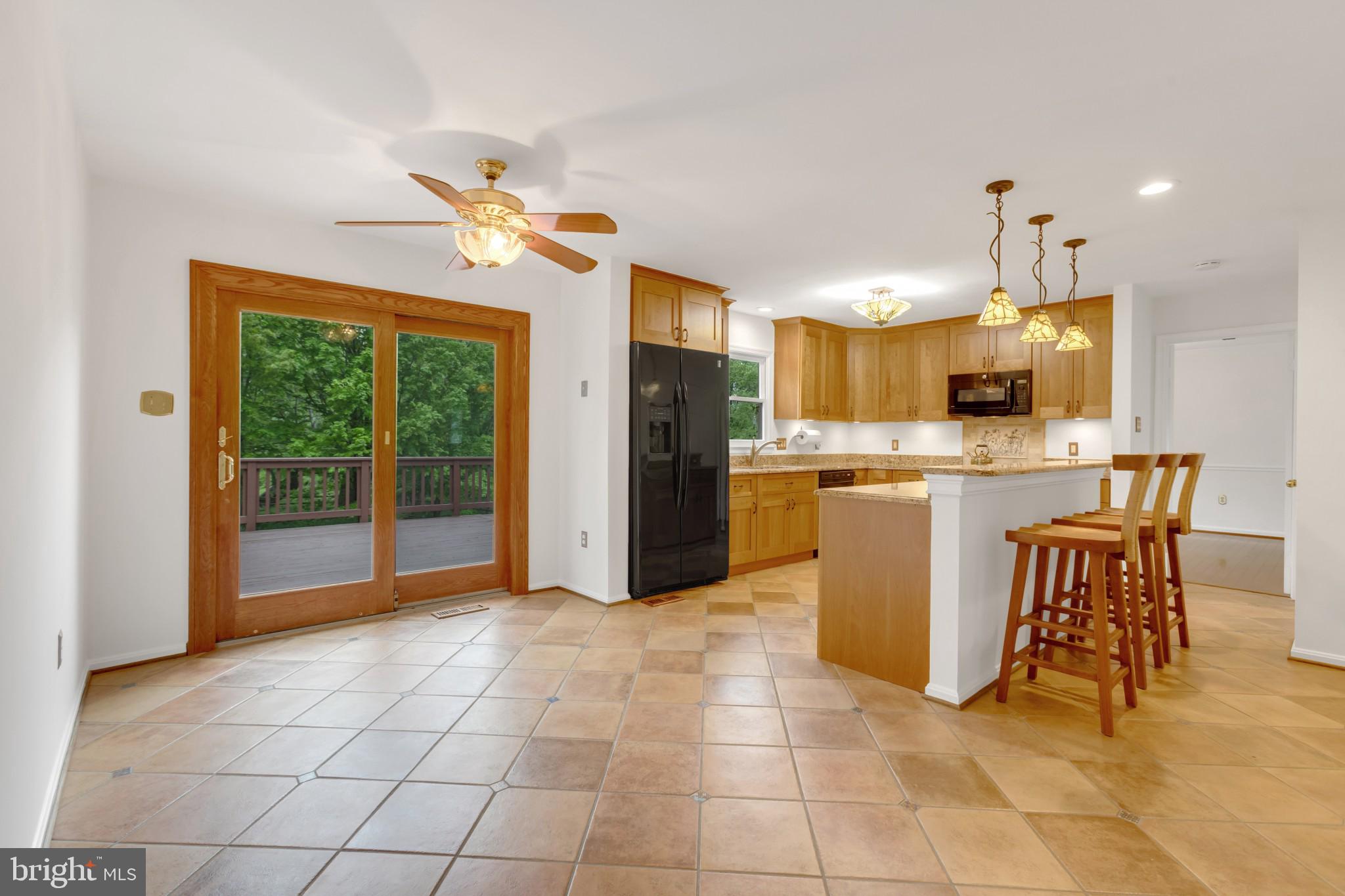 1921 Morningmist Drive Silver Spring, MD 20906 - Photo 5 of 38 Kitchen table space leads to the deck