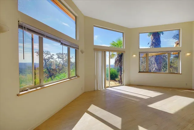 a living room with a couch and next to a window