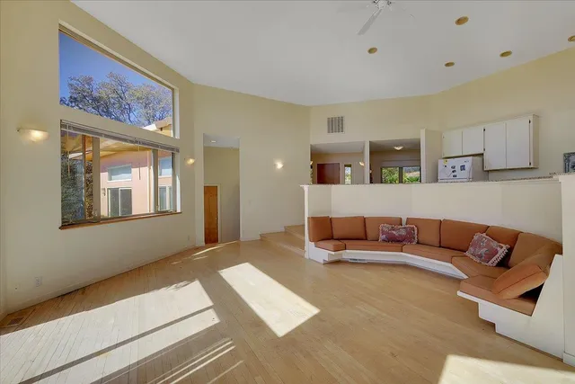 a kitchen with stainless steel appliances granite countertop a refrigerator and a stove