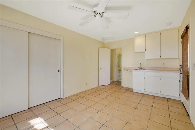 a view of dirt yard with a large tree