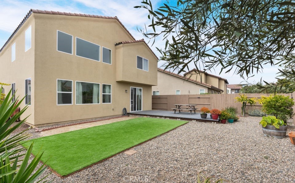 4575 Castillo Drive Guadalupe, CA 93434 - Photo 17 of 24 a front view of a house with a yard and garage