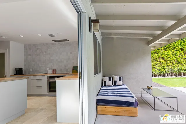 a kitchen with a sink appliances and cabinets