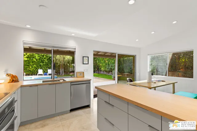 a kitchen with a sink and large window