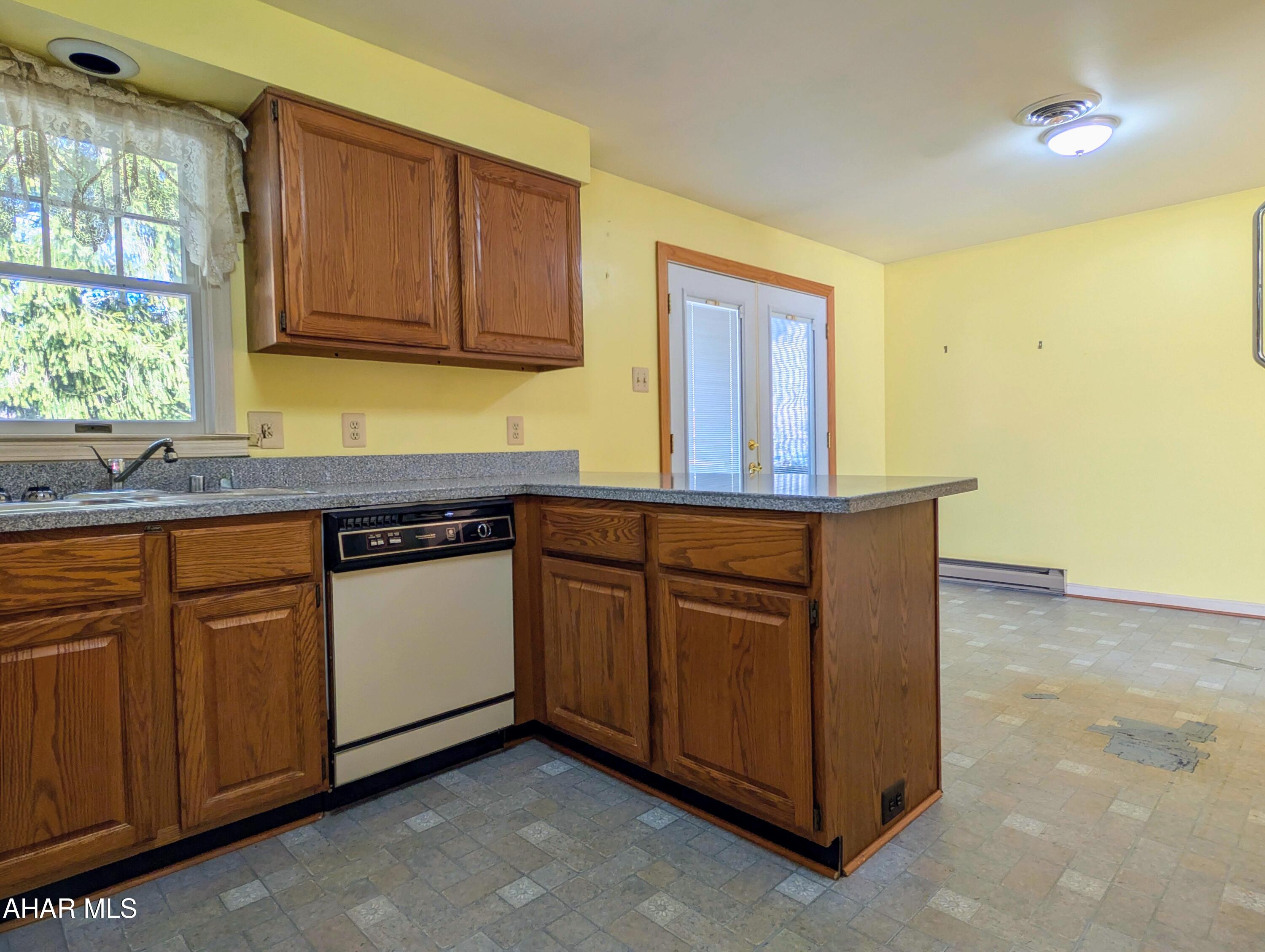 147 Pine Street Hyndman, PA 15545 - Photo 9 of 44 a kitchen with granite countertop a sink and cabinets