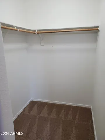 a view of an empty walk in closet