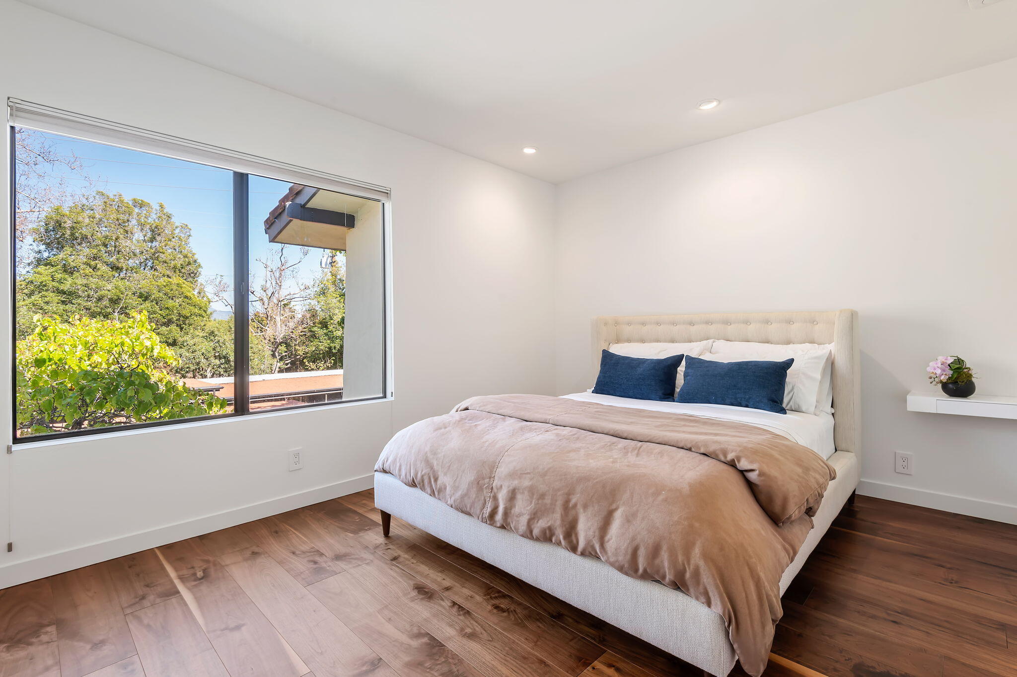 3375 Foothill Road, Unit 233 Carpinteria, CA 93013 - Photo 5 of 13 a large bed sitting in a bedroom next to a window