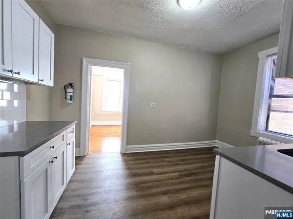 a kitchen with stainless steel appliances a refrigerator sink and cabinets