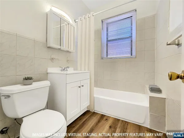 a view of a kitchen cabinets and wooden floor