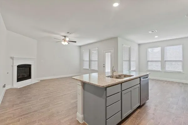 a kitchen with a sink and a stove