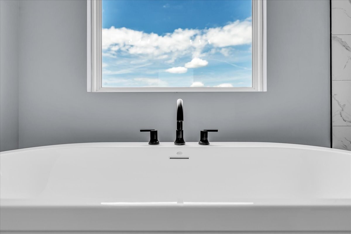 25 Lookout Drive Winchester, TN 37398 - Photo 41 of 61 a bathroom with a tub and a window
