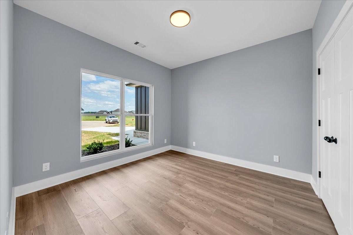 25 Lookout Drive Winchester, TN 37398 - Photo 50 of 61 a view of an empty room with a window and wooden floor