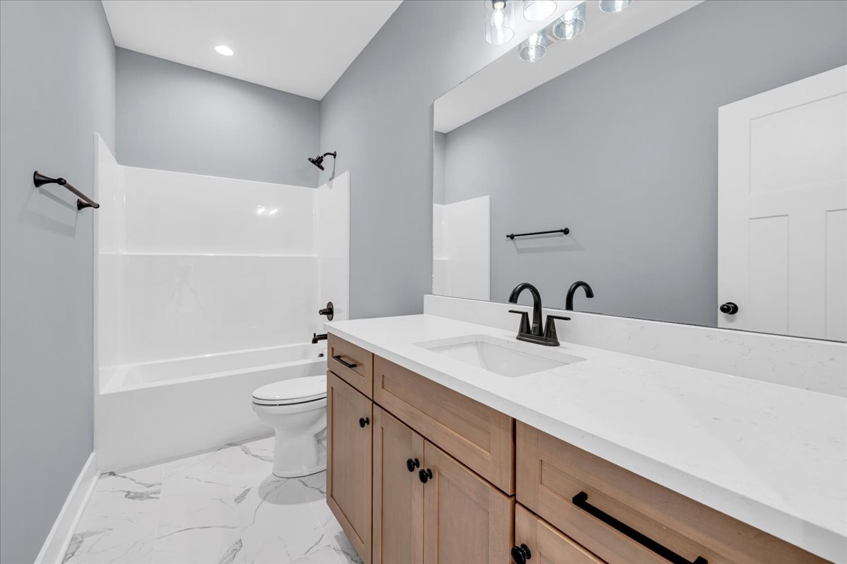 25 Lookout Drive Winchester, TN 37398 - Photo 56 of 61 a bathroom with a sink a toilet and shower