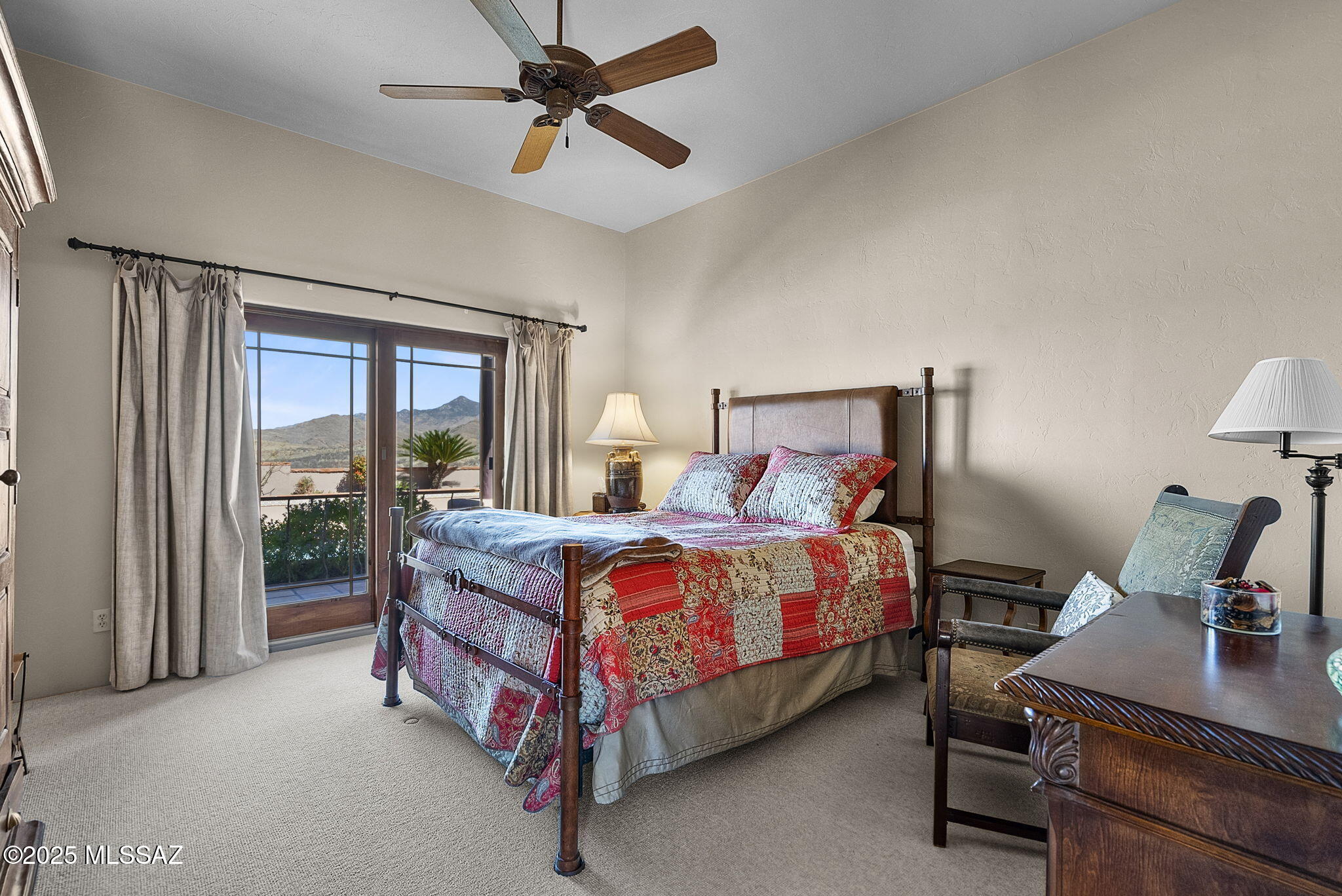 1265 Morning Star Drive Rio Rico, AZ 85648 - Photo 18 of 50 a bedroom with a bed and large windows
