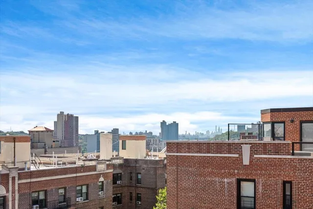 a balcony with table and chairs