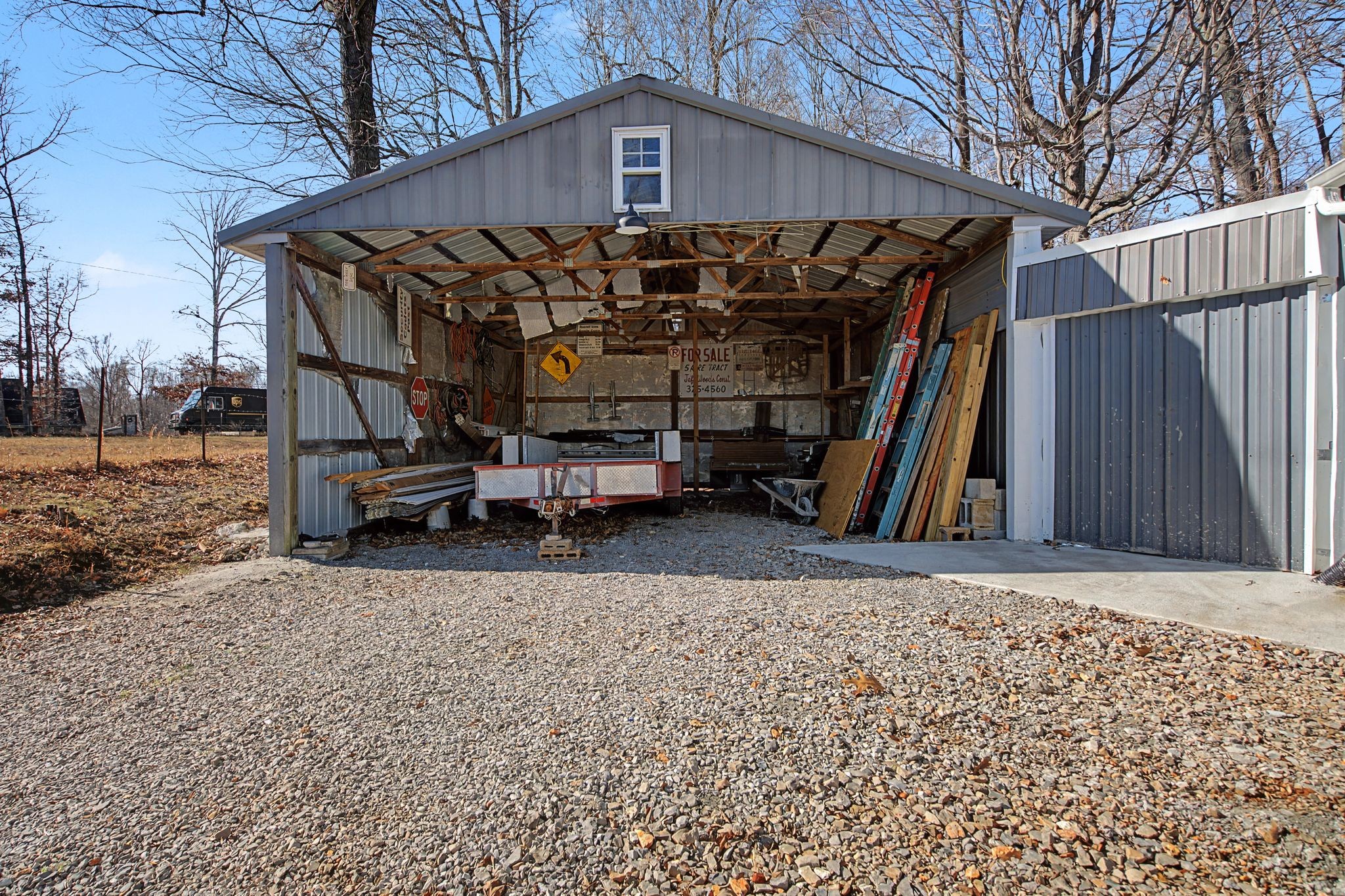 1075 Coker Ford Road Portland, TN 37148 - Photo 27 of 35 a view of a house with a wooden deck